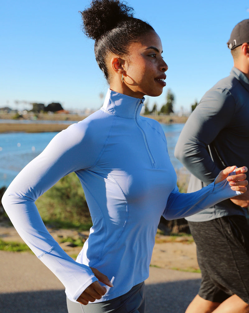 BloqUV women's long sleeve UV mock zip top in indigo blue.