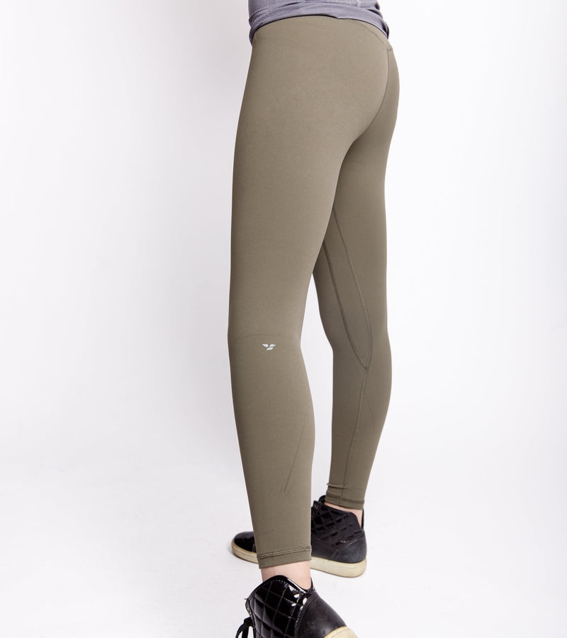 Back view of a woman wearing army green leggings.