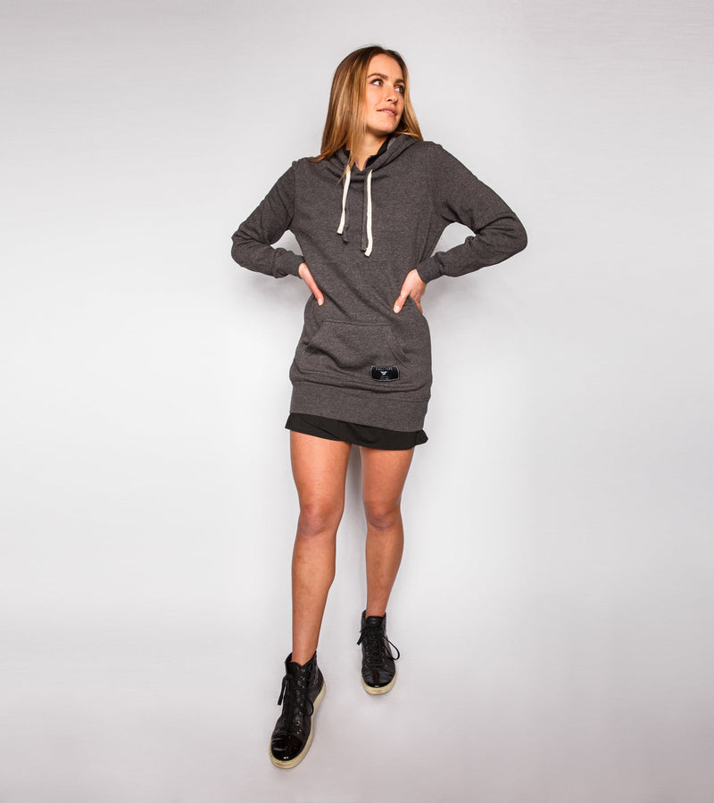 Woman wearing a gray sweatshirt dress.