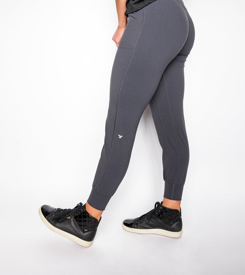 Side view of a woman wearing slate joggers.