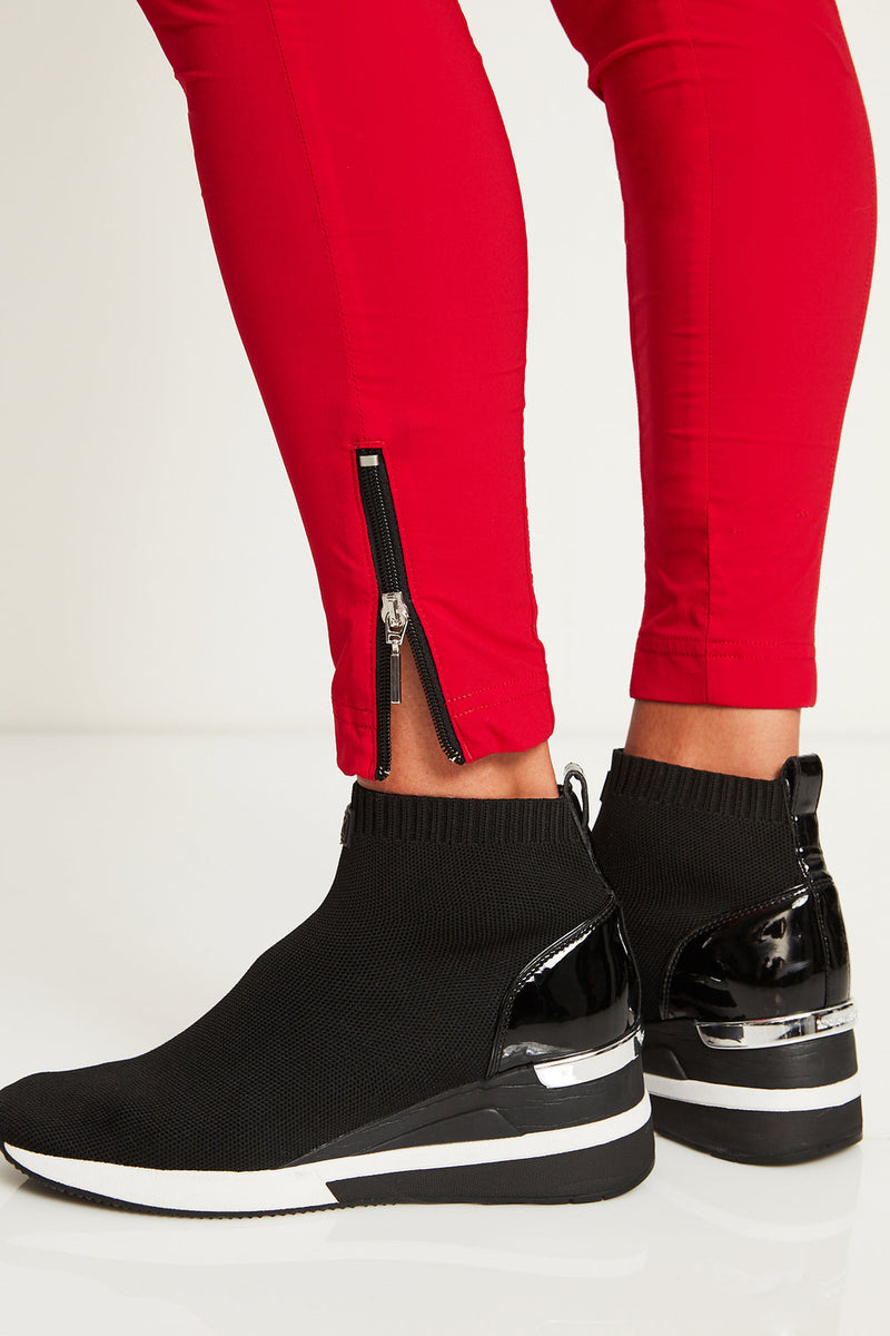 The Anatomie Allie Hybrid Travel Pant in Atomic Red, Bright Red Fabric, Slim Fit Pull On with Zippered Ankle.