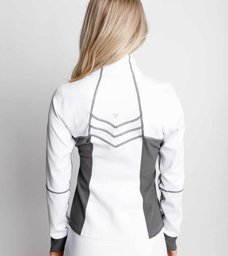 Close-up back view of a woman wearing a white jacket with gray sides and chevron stitching.