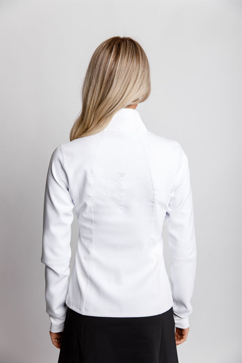  Close-up back view of a woman wearing a white pullover with chevron stitching.